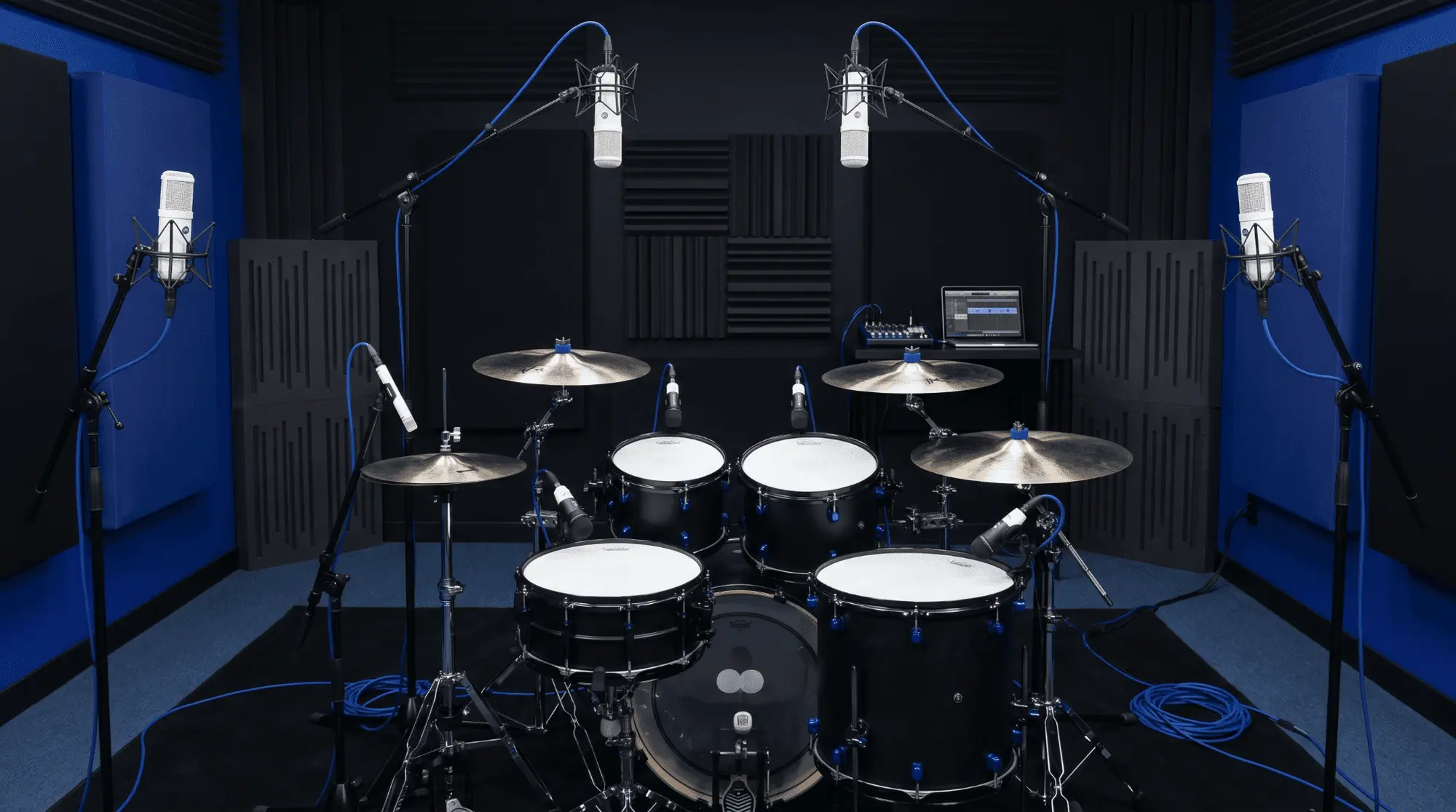 Studio drum kit recorded with multiple microphones, illustrating how close mics, overheads, and room microphones can create phase cancellation if not aligned carefully.